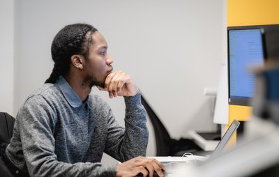 Employee looking at PC screen